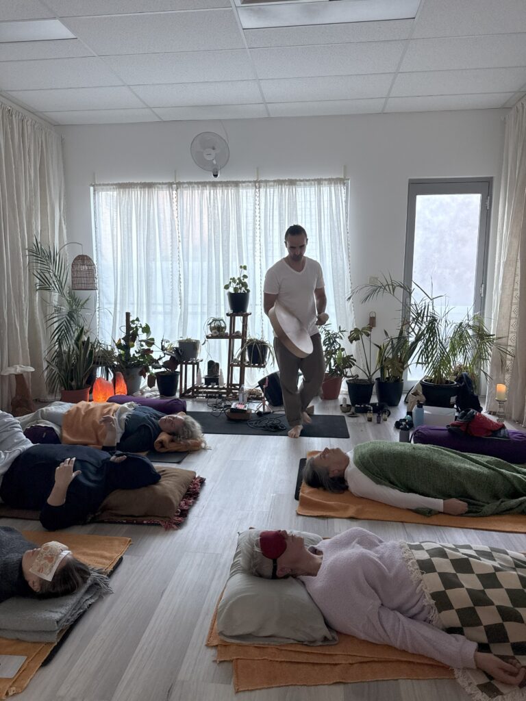 James Bailey holding space in Fremantle for Innerdance with a medicine drum