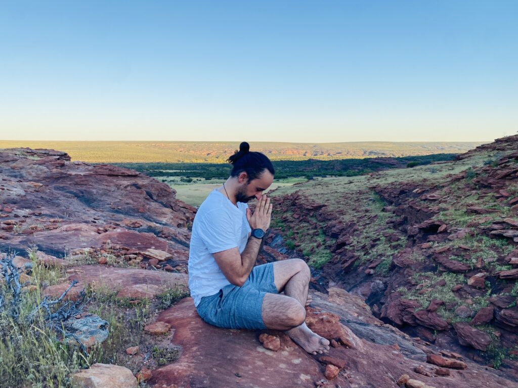 James Bailey meditating in a beautiful landscape